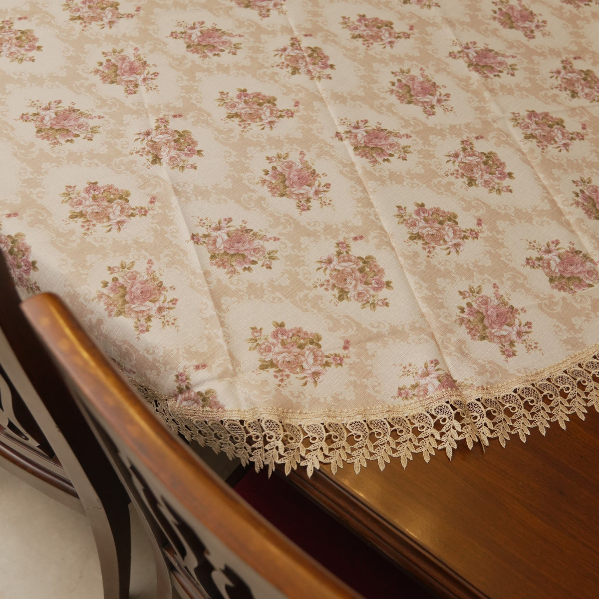 Edge drape of the round table sheet showing the lace trim