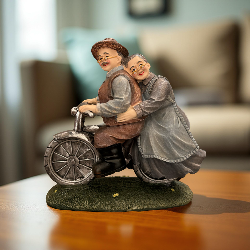 Romantic Elderly Couple on Bicycle Figurine