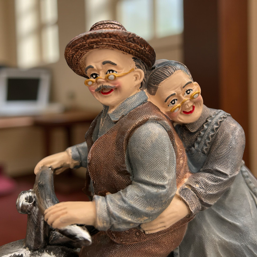 Romantic Elderly Couple on Bicycle Figurine
