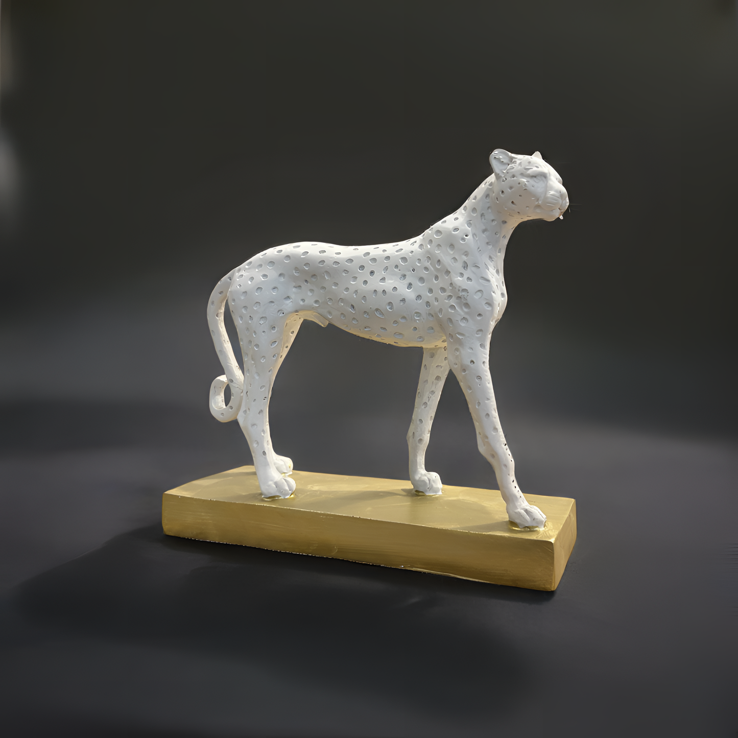 White Cheetah Sculpture on Golden Base