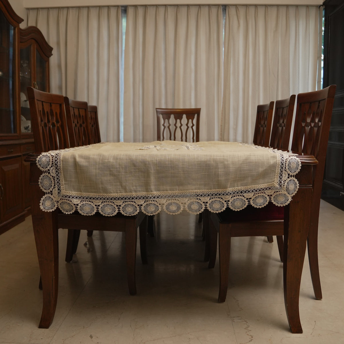 Grey medallion lace table sheet on a dining table