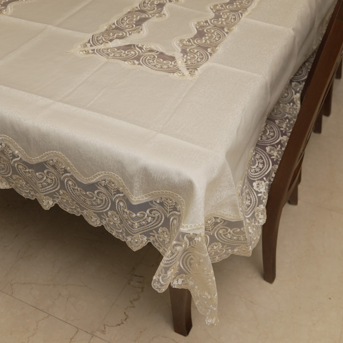 Ivory table sheet with sheer lace border on a 6 seater dining table