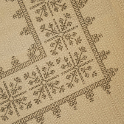 Close-up of the grey cross-stitch geometric pattern