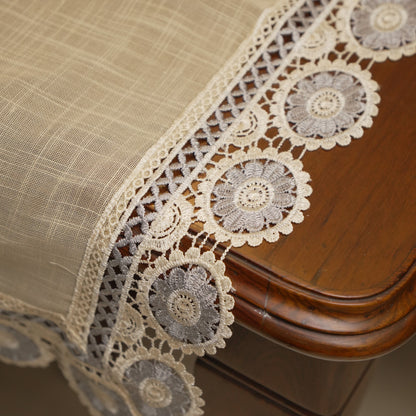 Grey medallion lace border at the table edge