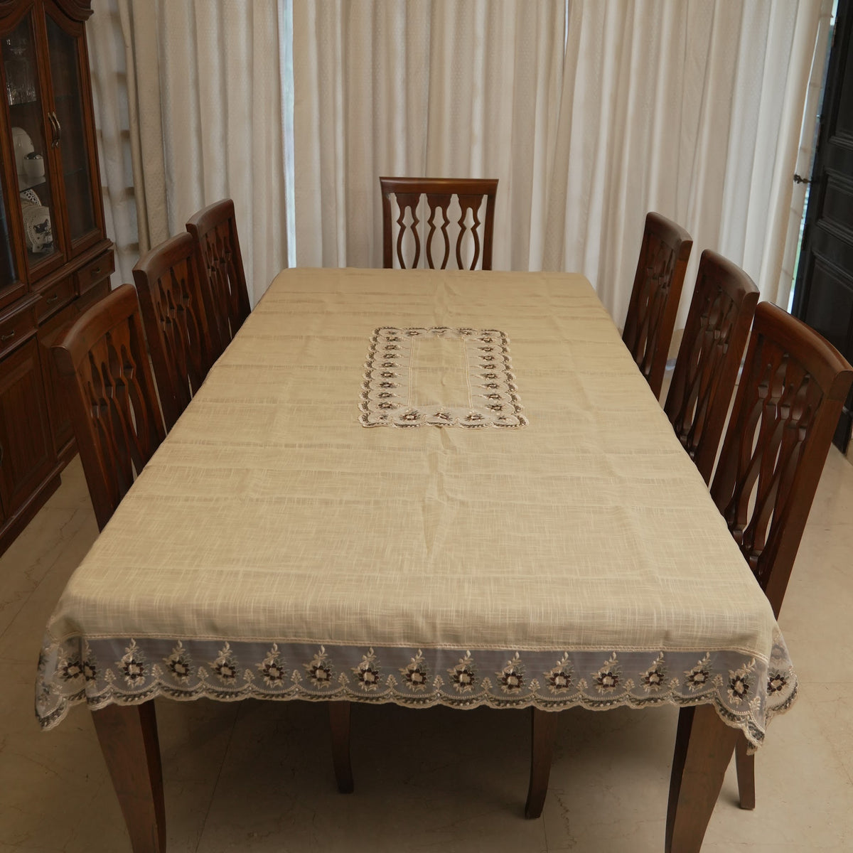 Floral lace border table sheet on an 8 seater dining table