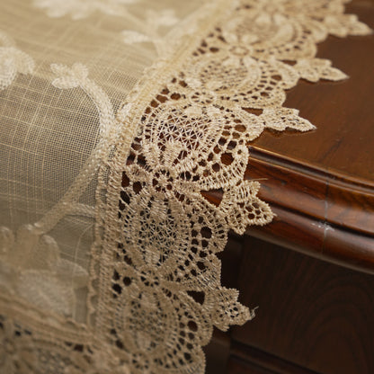 Corner showing the cream lace border