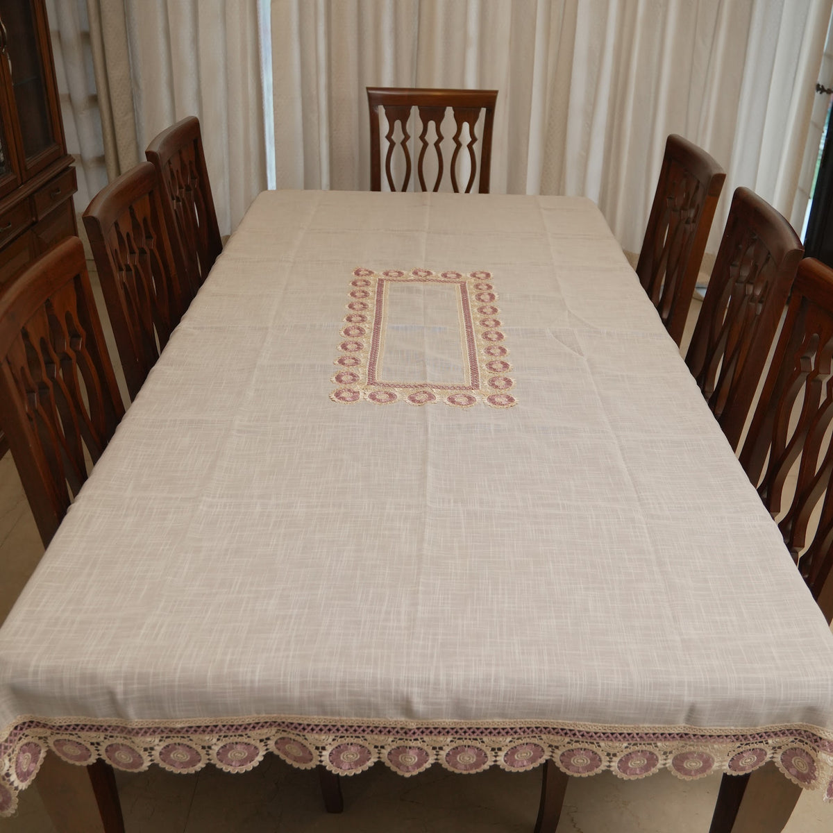Mauve medallion lace table sheet on an 8 seater dining table