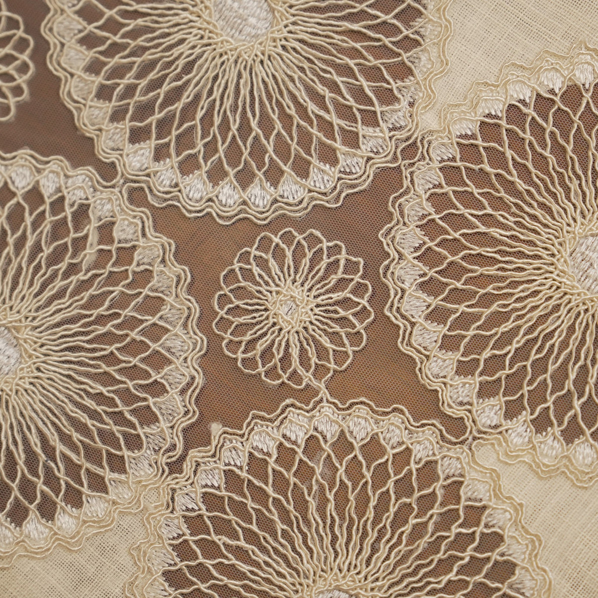 Close-up of the sunburst lace medallions