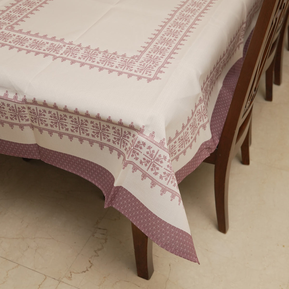 Corner of the table sheet with rose pink edging band