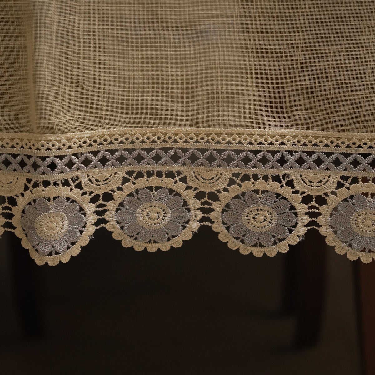 Close-up of the grey crochet medallions