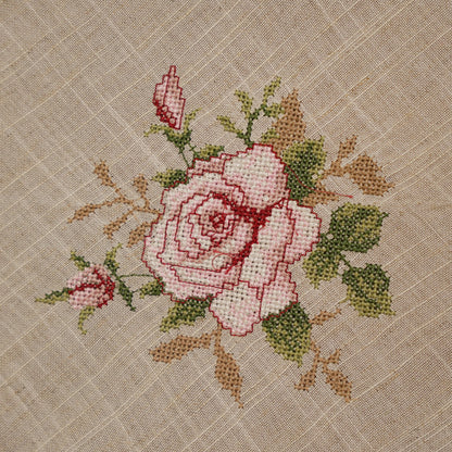 Close-up of the pink cross-stitch rose