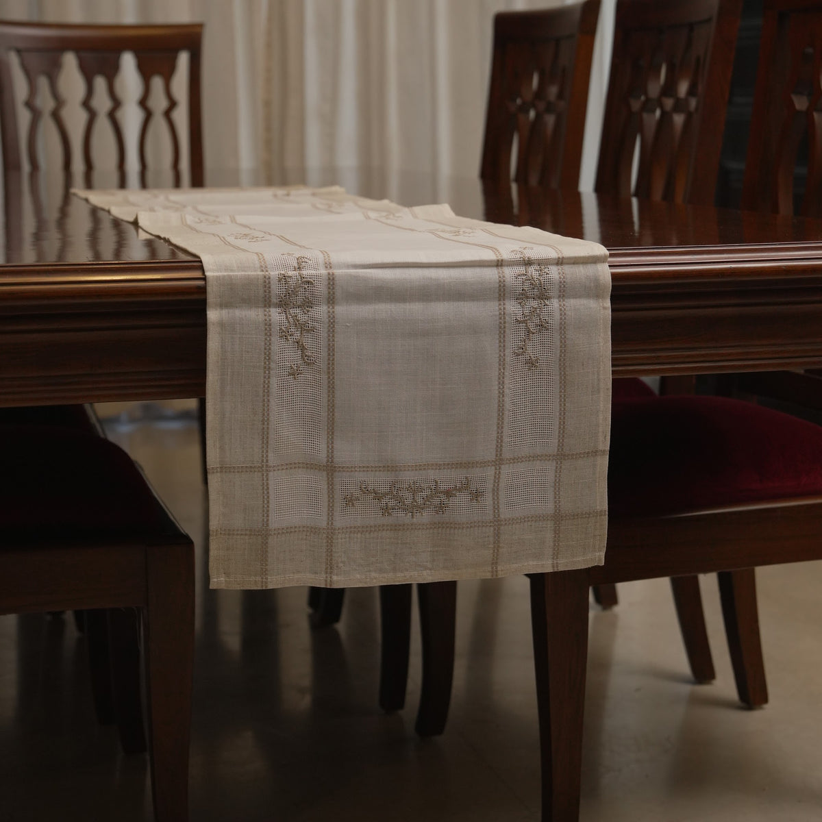 Table runner draped over the end of the dining table