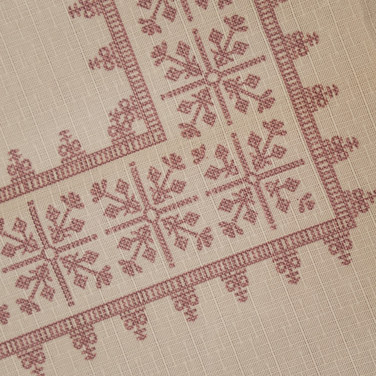 Close-up of the rose pink cross-stitch pattern