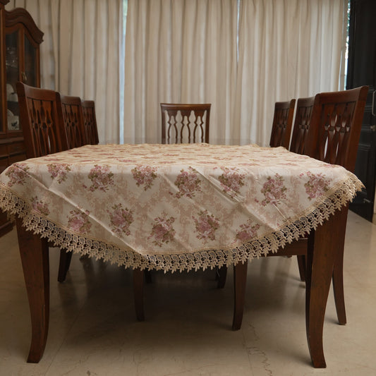 Vintage rose print round table sheet with lace border on a round dining table