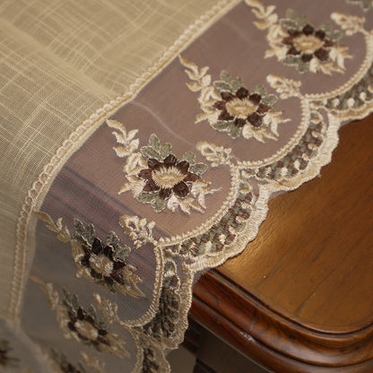Sheer border with maroon floral embroidery at the table edge