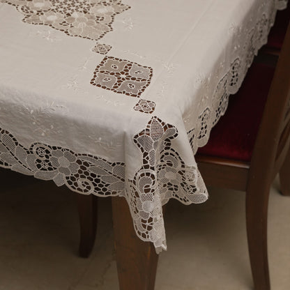 White cutwork lace table sheet on a 6 seater dining table