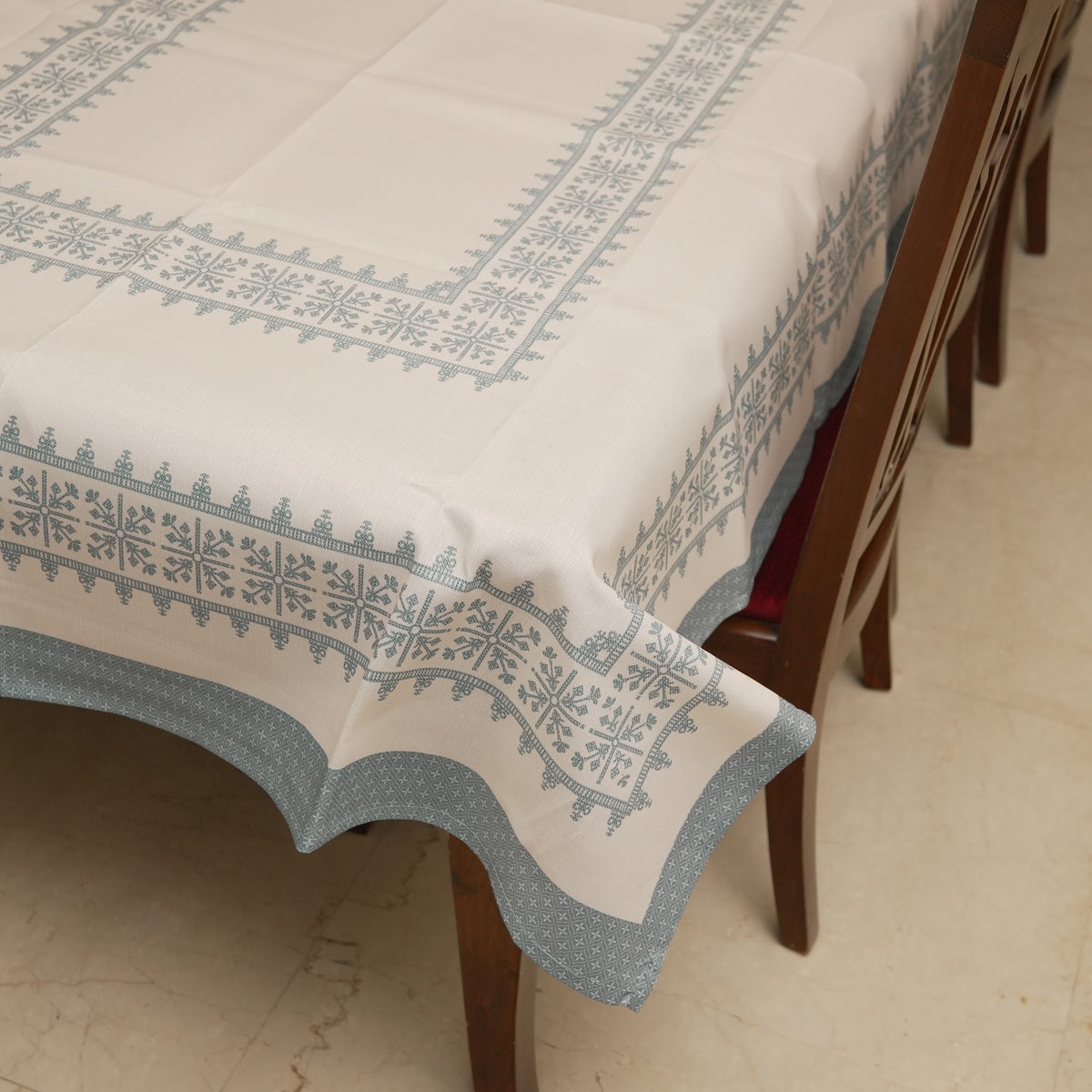 Corner of the table sheet with teal blue edging band