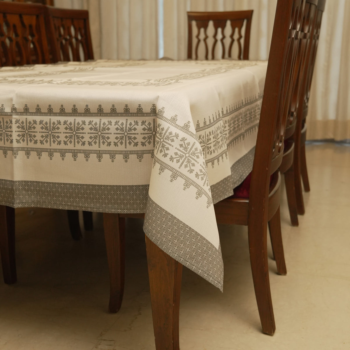 Grey cross-stitch border table sheet on a 6 seater dining table
