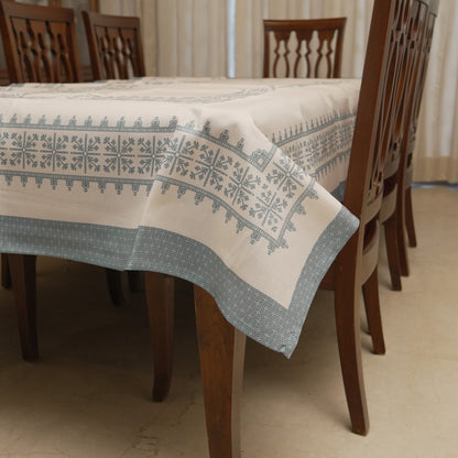 Teal blue cross-stitch border table sheet on a 6 seater dining table