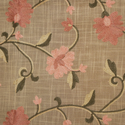 Close-up of the pink blossom and vine embroidery