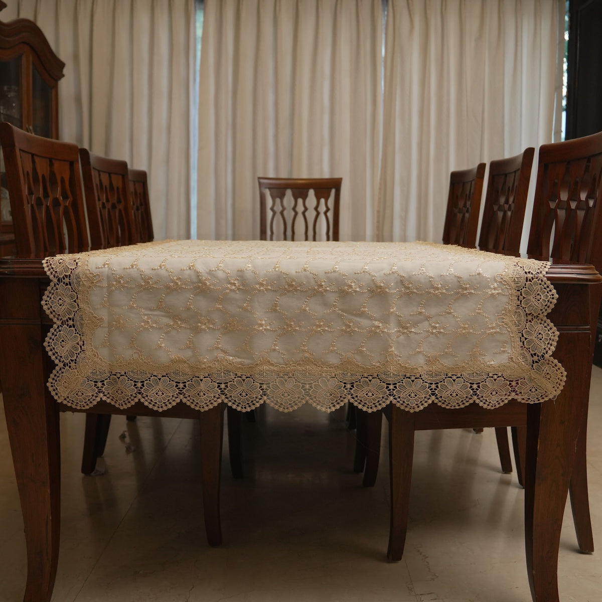 Gold floral sheer table sheet on a dining table