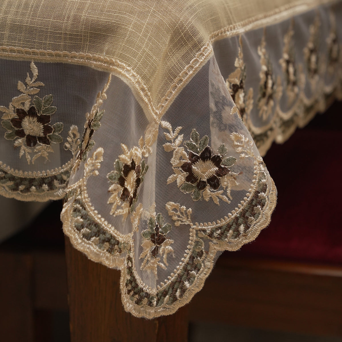 Close-up of the sheer lace border with embroidered floral motifs