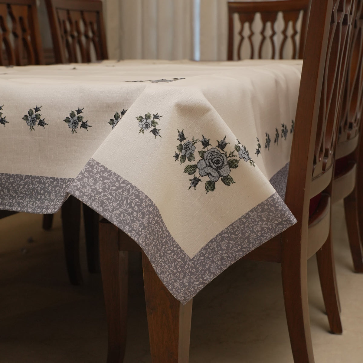 Grey cross-stitch rose table sheet on a 6 seater dining table