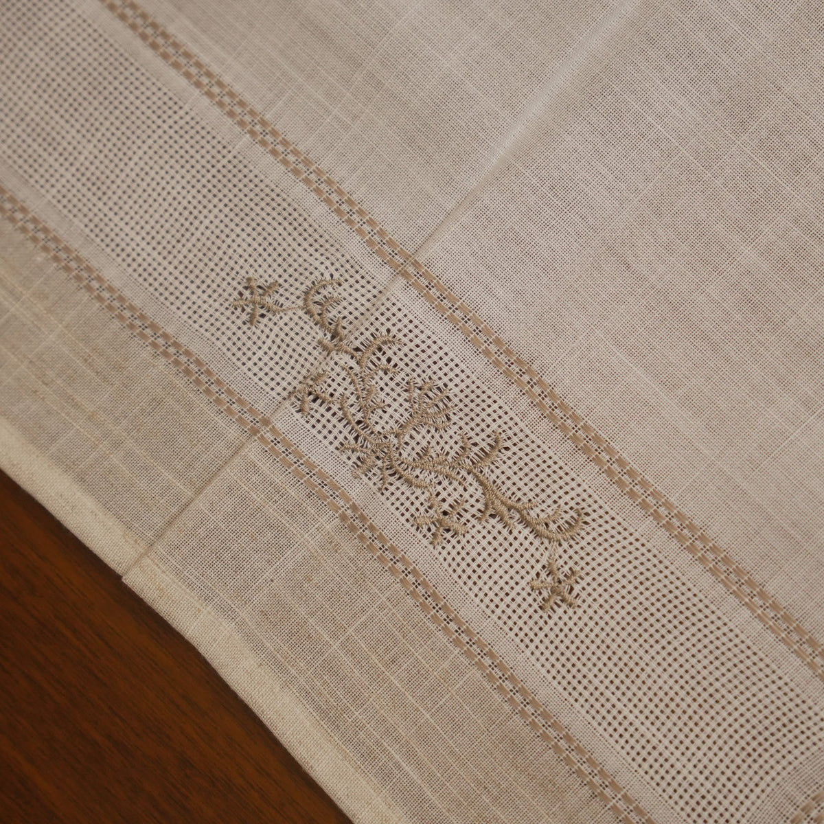 Close-up of the cross-stitch floral sprig