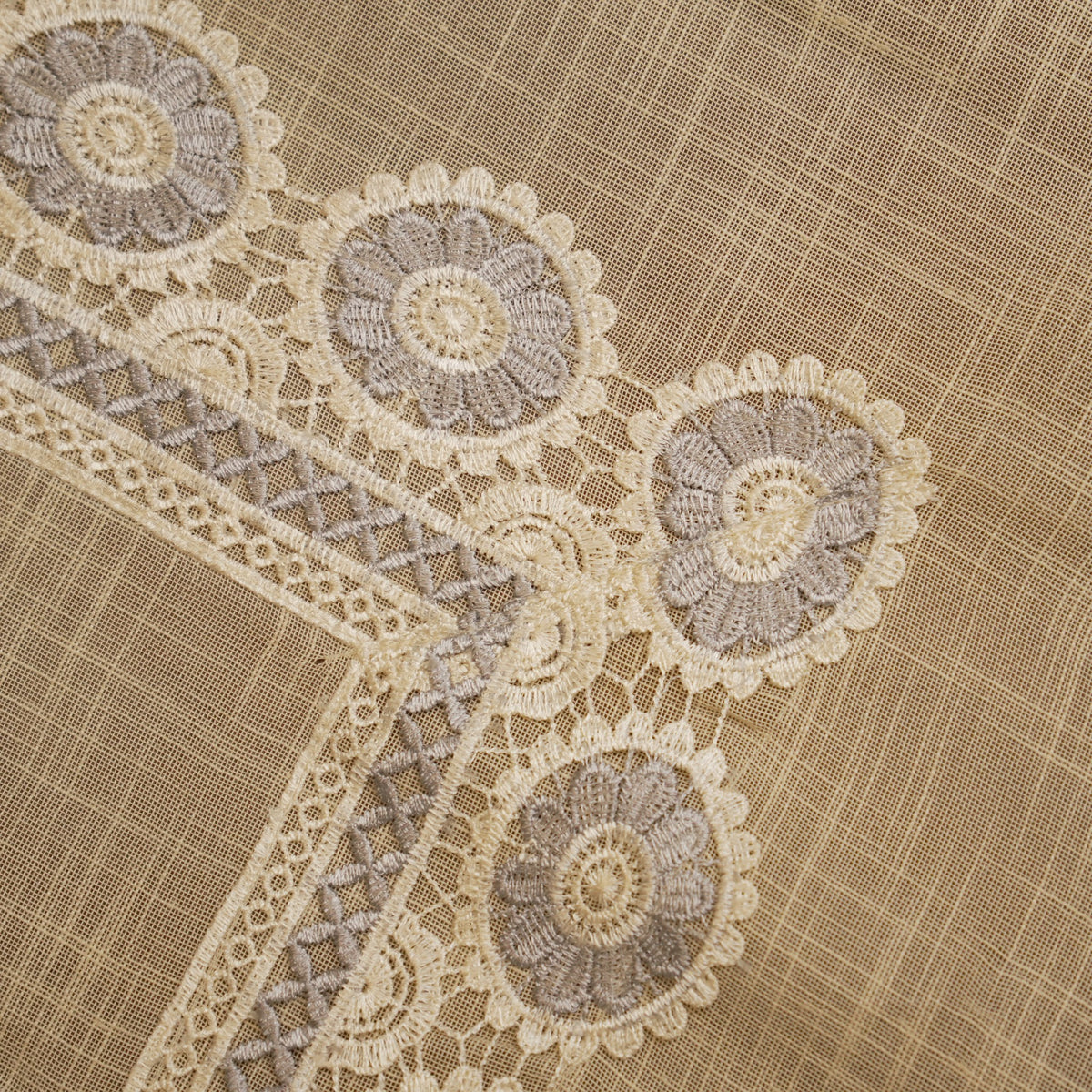 Close-up of the grey crochet medallions