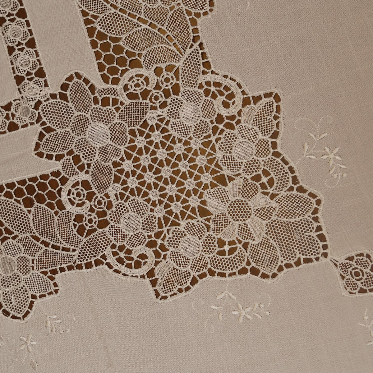 Close-up of the cutwork lace corner motif