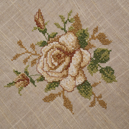 Close-up of the cream cross-stitch rose