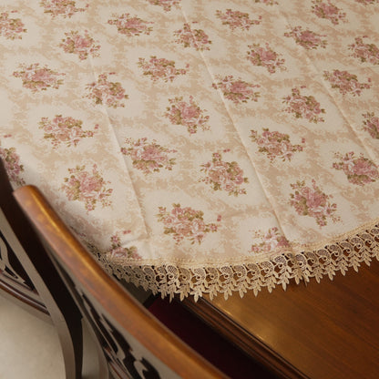 Edge drape of the round table sheet showing the lace trim