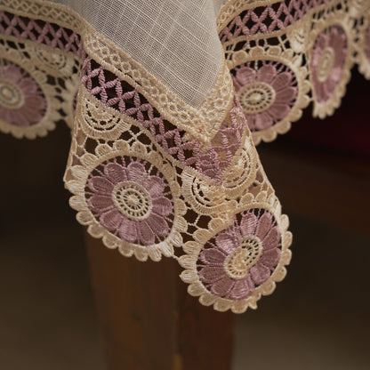 Corner drape showing the mauve crochet medallion lace border