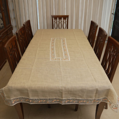 Peach floral sheer border table sheet on an 8 seater dining table