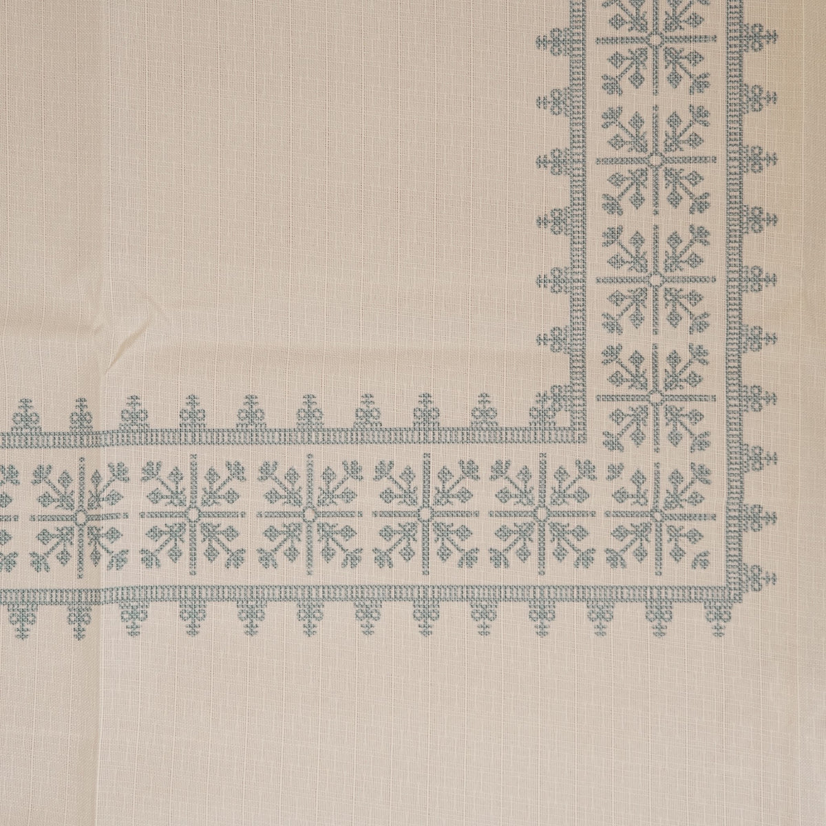 Top view of the cross-stitch border corner