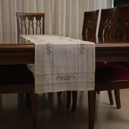 Table runner draped over the end of the dining table