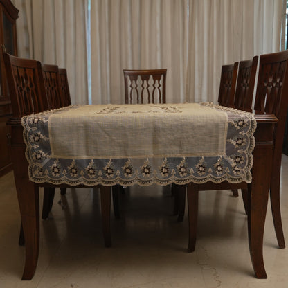 Maroon floral sheer border table sheet on a dining table