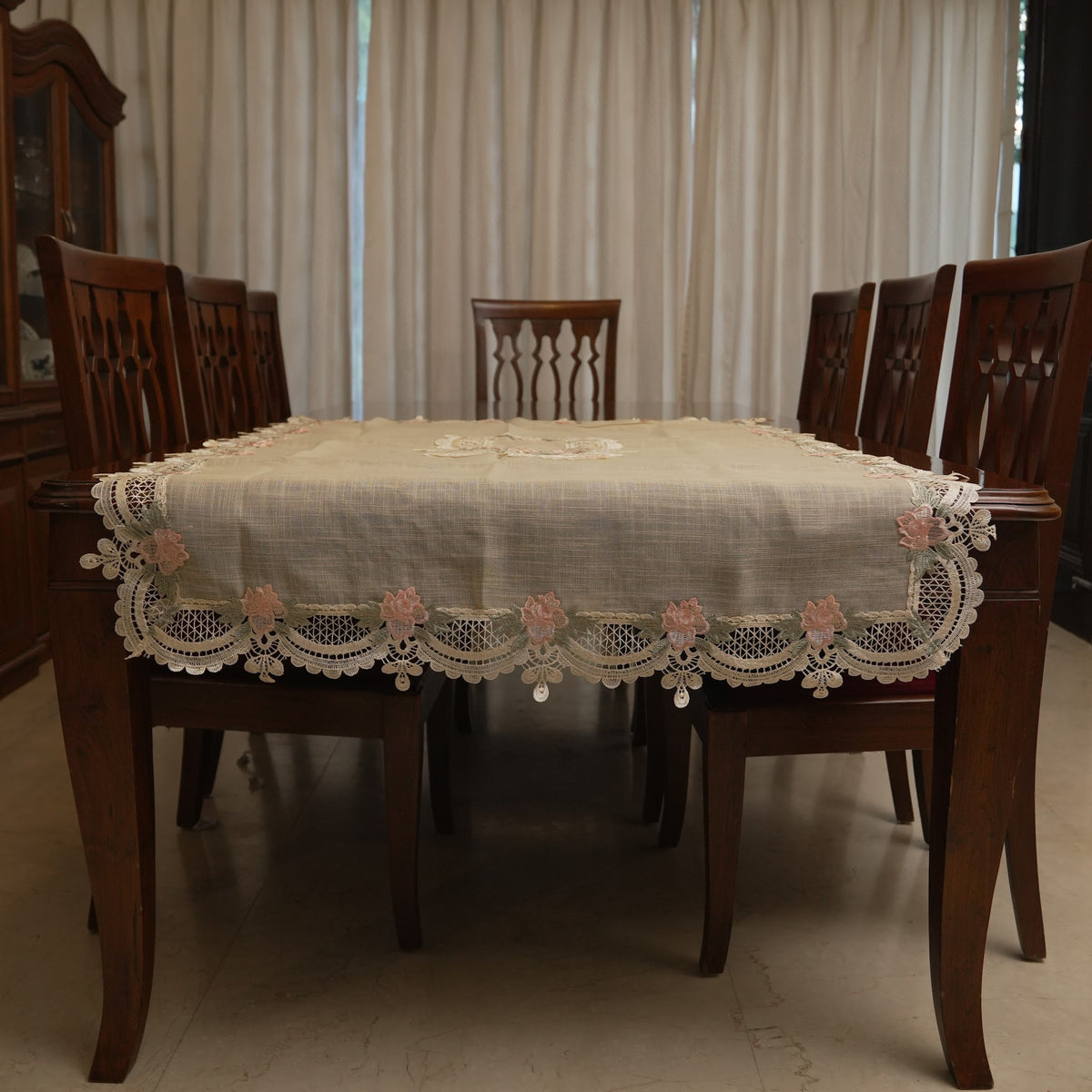 Pink rose lace table sheet on a dining table