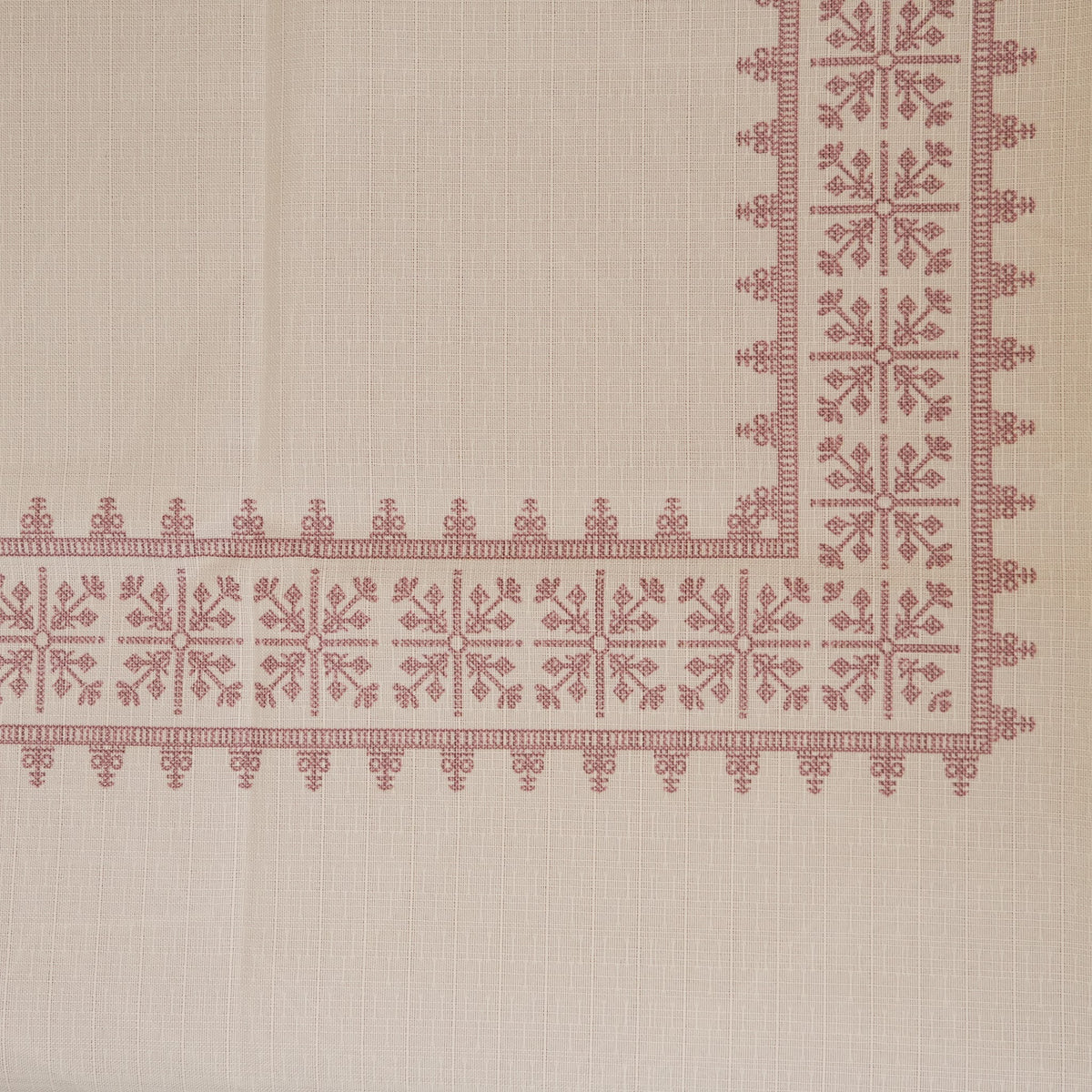Top view of the cross-stitch border corner