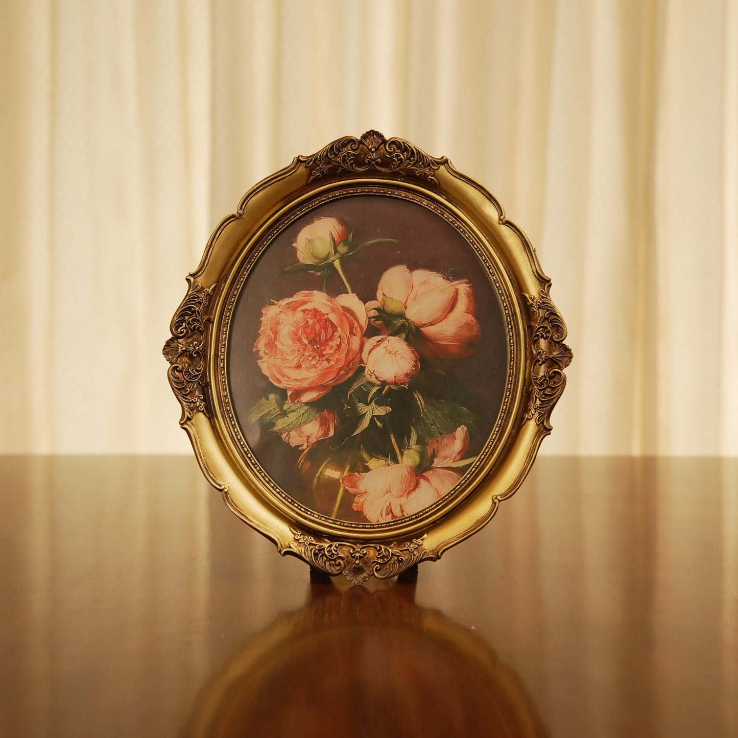 Elegant Oval Gold Decorative Frame with Classic Rose Design