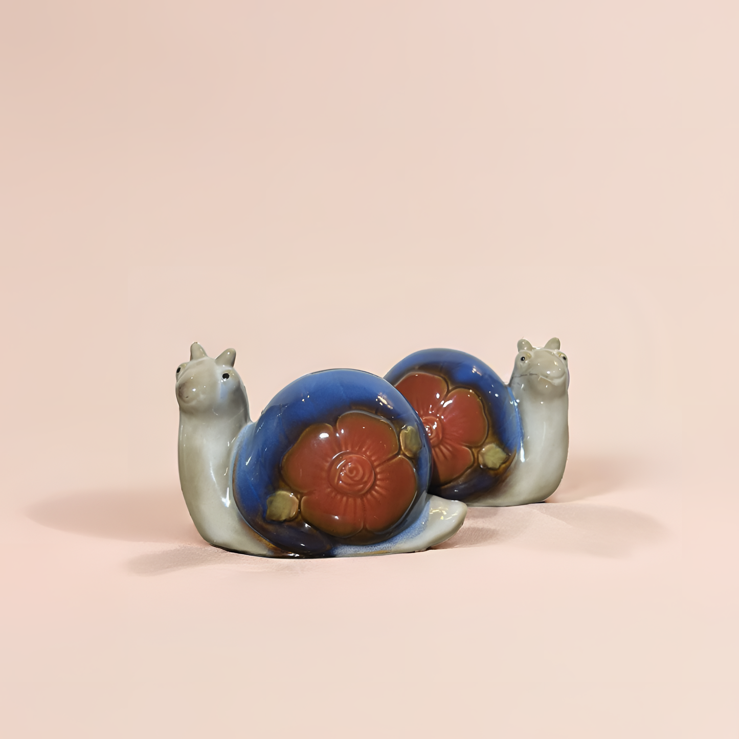 Whimsical Ceramic Snail Duo – Floral Shell Garden Figurines ( Set of 2 pieces )